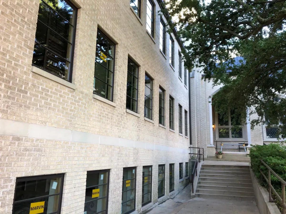 Brick church with new windows installed on every floor